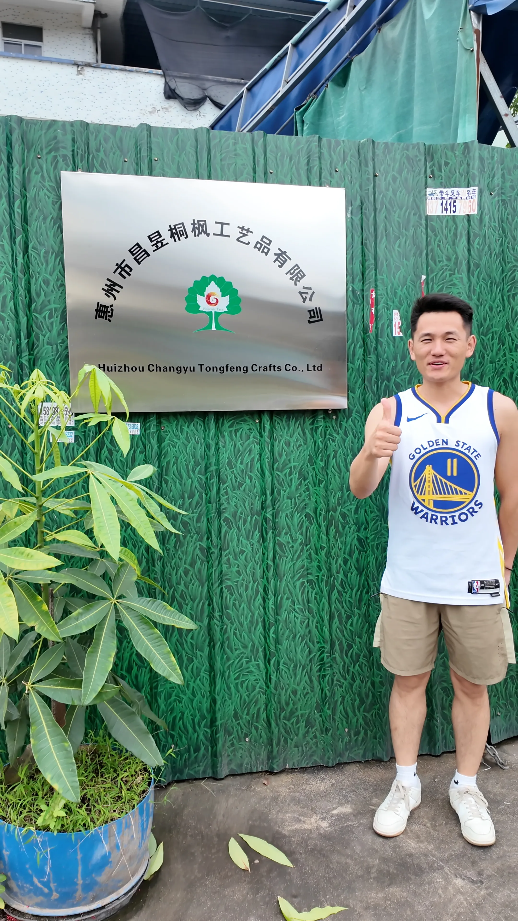Team member at the artificial plant factory entrance